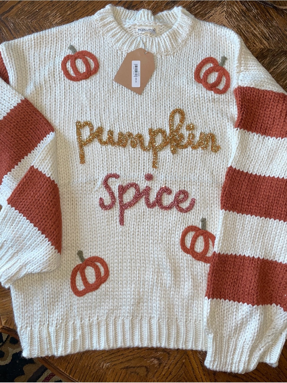 Pumpkin Spice sweater. Cream Sweater with Rust Stripe Sleeves and Pumpkin Motifs